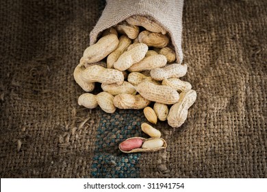 fresh ground nuts on sackcloth 