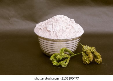 Fresh Ground  Ragi Atta Or Finger Millet Flour In A Bowl With Finger Millet Ear.