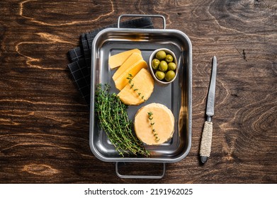 Fresh Halloumi Sliced Cheese In Kitchen Tray With Thyme. Wooden Background. Top View.