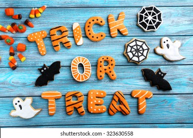 Fresh Halloween Gingerbread Cookies On Blue Wooden Table