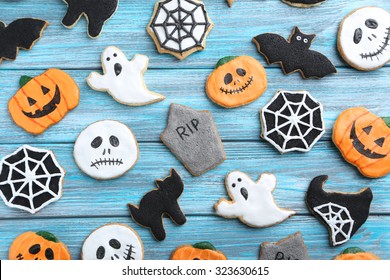 Fresh Halloween Gingerbread Cookies On Blue Wooden Table