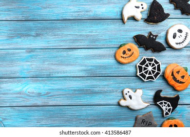 Fresh Halloween Gingerbread Cookies On Blue Wooden Table