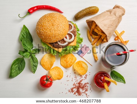 Fresh hamburger with French fries on white background