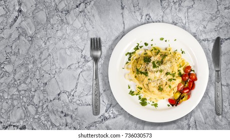 Fresh Handmade Tagliatelle Pasta With Forest Mushrooms, Parsley And Cherry Tomatoes Salad On Granite Kitchen Countertop. Top View With Copy Space Added.