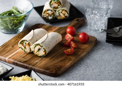 Fresh Healthy Chargrilled Tandoori Chicken Wrap With Tzatziki, Cheese, Baby Spinach And Carrots 