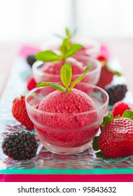 Fresh and healthy ice cream sorbet made with real fruit like strawberry and berry.Very shallow depth of field.