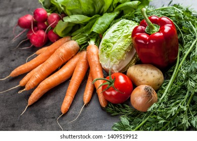 Fresh and healthy organic vegetables on a rustic background - Shutterstock ID 1409519912