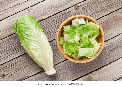 Fresh Healthy Romaine Lettuce Salad On Wooden Table. Top View