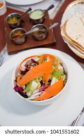 Fresh Healthy Vegetable Salad With Carrot Shavings And Bread