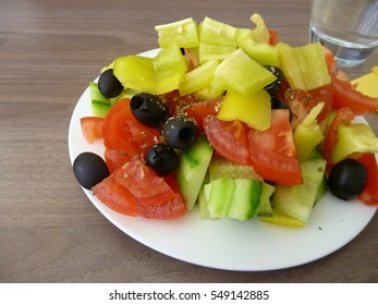 a fresh healthy vegetable salad served on a white plate