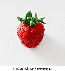 Fresh heart shaped strawberry isolated on a white background