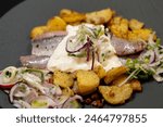 Fresh herb matjes with fried potatoes and Sylt sauce