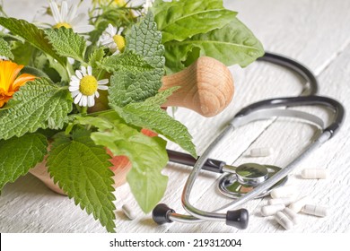 Fresh herb and stethoscope alternative medicine concept