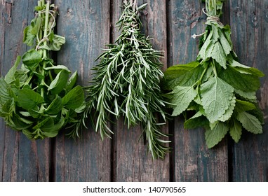 Fresh Herbs. Melissa, Rosemary And Mint In Rustic Setting