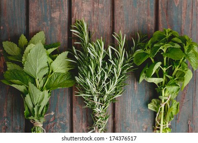 Fresh Herbs. Melissa, Rosemary And Mint In Rustic Setting