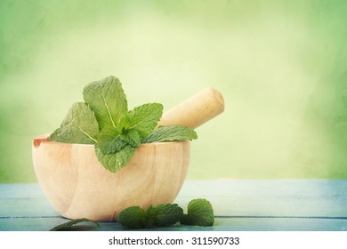 Fresh herbs in a mortar - Powered by Shutterstock