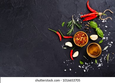 Fresh herbs and spices on black stone table. Cooking concept. Copy space - Powered by Shutterstock