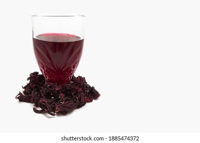 fresh hibiscus water in glass and dried hibiscus flower (karkade, red sorrel, jamaica) 