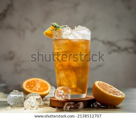 fresh home made orange lemonade or kombucha in tall glass over grey background, healthy eating, detox, wellbeing concept. High quality photo Stock photo © 