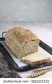 Fresh Homemade Baked Whole Grain Quinoa Bread And Sliced Bread On Wooden Table

