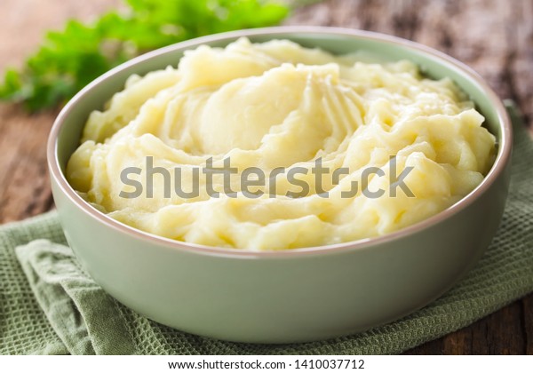 Fresh homemade creamy mashed\
potato in bowl (Selective Focus, Focus one third into the potato\
puree)