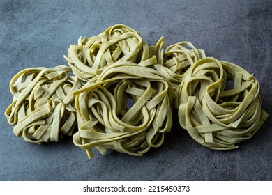 Fresh Homemade Green Pasta Tagliatelle. Raw Homemade Spinach Pasta.