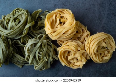 Fresh Homemade Green And Yellow Pasta Tagliatelle. Raw Homemade Spinach Pasta.