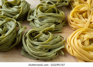 Fresh homemade green and yellow pasta tagliatelle. Raw homemade spinach pasta. - Powered by Shutterstock