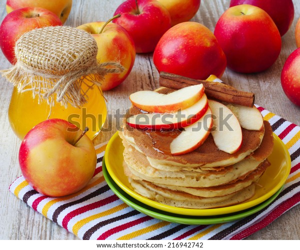 Fresh
homemade pancake with apples, honey and
cinnamon