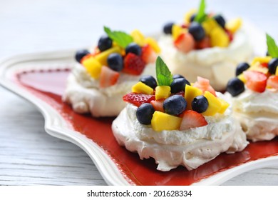 Fresh Homemade Pavlova Cakes With Mango And Berries 