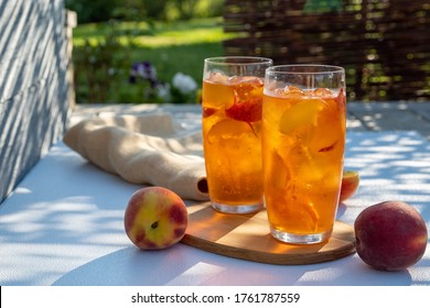 Fresh Homemade Peach Sweet Tea With Ice Cubes In Glass.