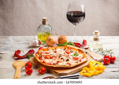 Fresh Homemade Pizza Served With Red Wine