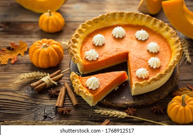 Fresh Homemade Pumpkin Pie On The Wooden Table