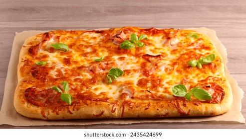 Fresh homemade rectangle pizza on table