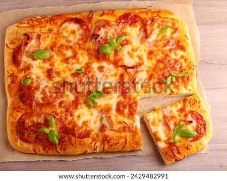 Fresh homemade rectangle pizza on table