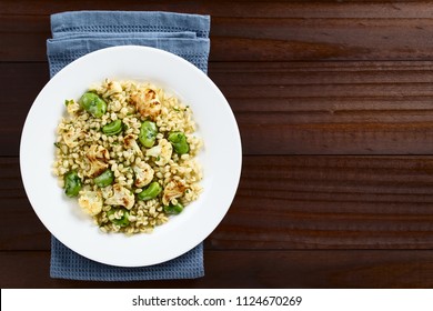 Fresh Homemade Vegan Salad Made Of Pearled Barley, Broad Beans, Roasted Cauliflower And Parsley, Photographed Overhead With Copy Space