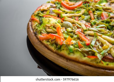 fresh homemade veggie pizza with vegetables On a wooden board - Powered by Shutterstock