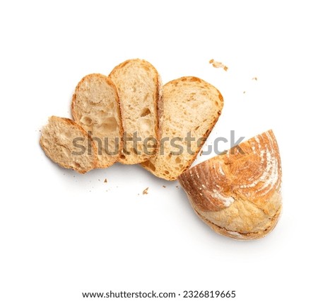 Fresh homemade wheat bread is cut with slides on a white background top view. Sliced white bread from a bakery on isolation. Craft bread.