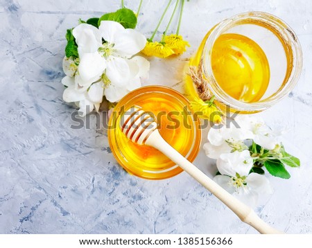 Similar – Image, Stock Photo Honey flows from glass and flowers