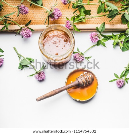 Image, Stock Photo Honey in glass with honeycomb and blossoms