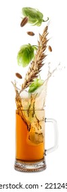 Fresh Hops Flowers With Leaves And Wheat Grains Falling Into Glass Mug Of Beer On White Background