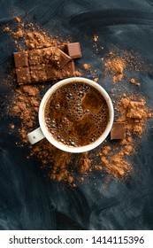 Fresh Hot Steaming Chocolate In A Cup, Chocolate Bar And Cocoa On The Dark Table