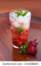 Fresh iced Strawberry Mojito with Strawberry syrup and fizzy water. Strawberry Mojito will never go wrong on a hot summer day and it is easy to make.