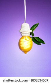 A Fresh Idea With A Light Bulb Superimposed Over A Lemon With Leaves Hanging From A Light Cord