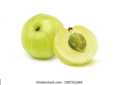 Fresh Indian gooseberry fruits and cut in half with seed isolated on white background. Clipping path.