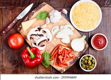 Fresh ingredients for homemade pizza on wooden table - Powered by Shutterstock