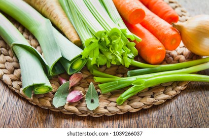 Fresh ingredients for veggie stock : carrots, celery, leeks, onion, carrots, parsnip, parsley, garlic, peppercorns, chili. Spring and summer products for soup seasonal vegetables, best from farm shop.