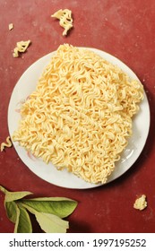 Fresh Instant Noodles On White Plate, Top View 
