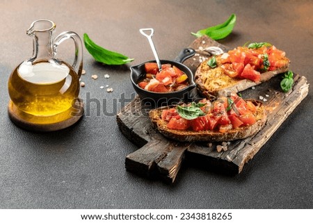 Fresh italian sandwiches with tomatoes on wooden board. Delicious snack and appetizer. place for text, top view.