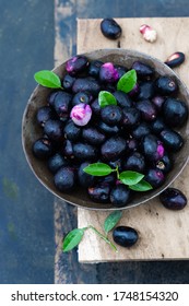 Fresh Java Plum in a bowl on dark background, Horizontal and Vertical view. 